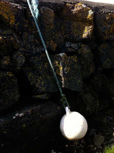 white-buoy-dangling-Rockcliffe-jetty